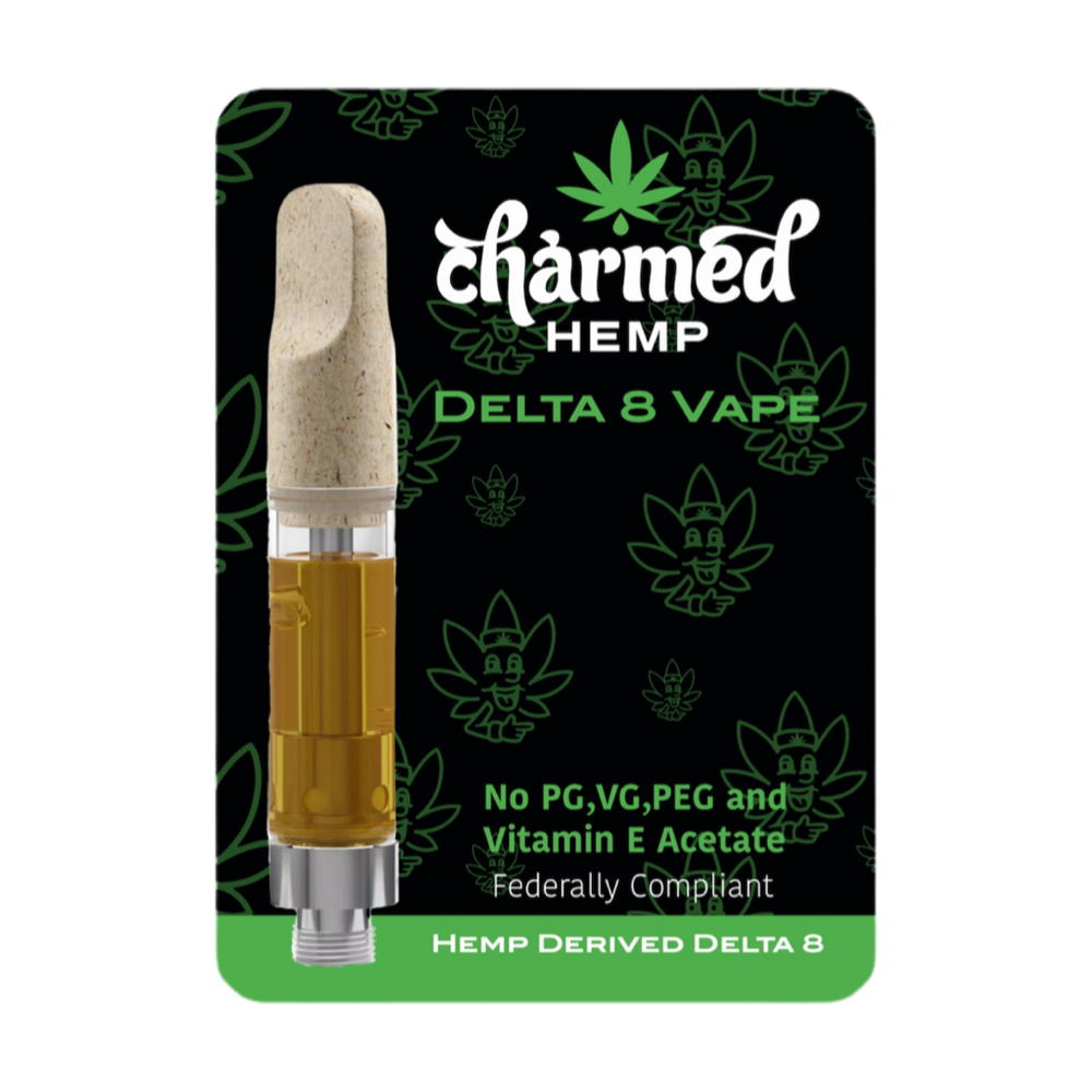 A product image featuring a Delta 8 THC vape cartridge from Charmed Hemp. The cartridge is shown with a ceramic mouthpiece, and the background is black with green leaf accents.